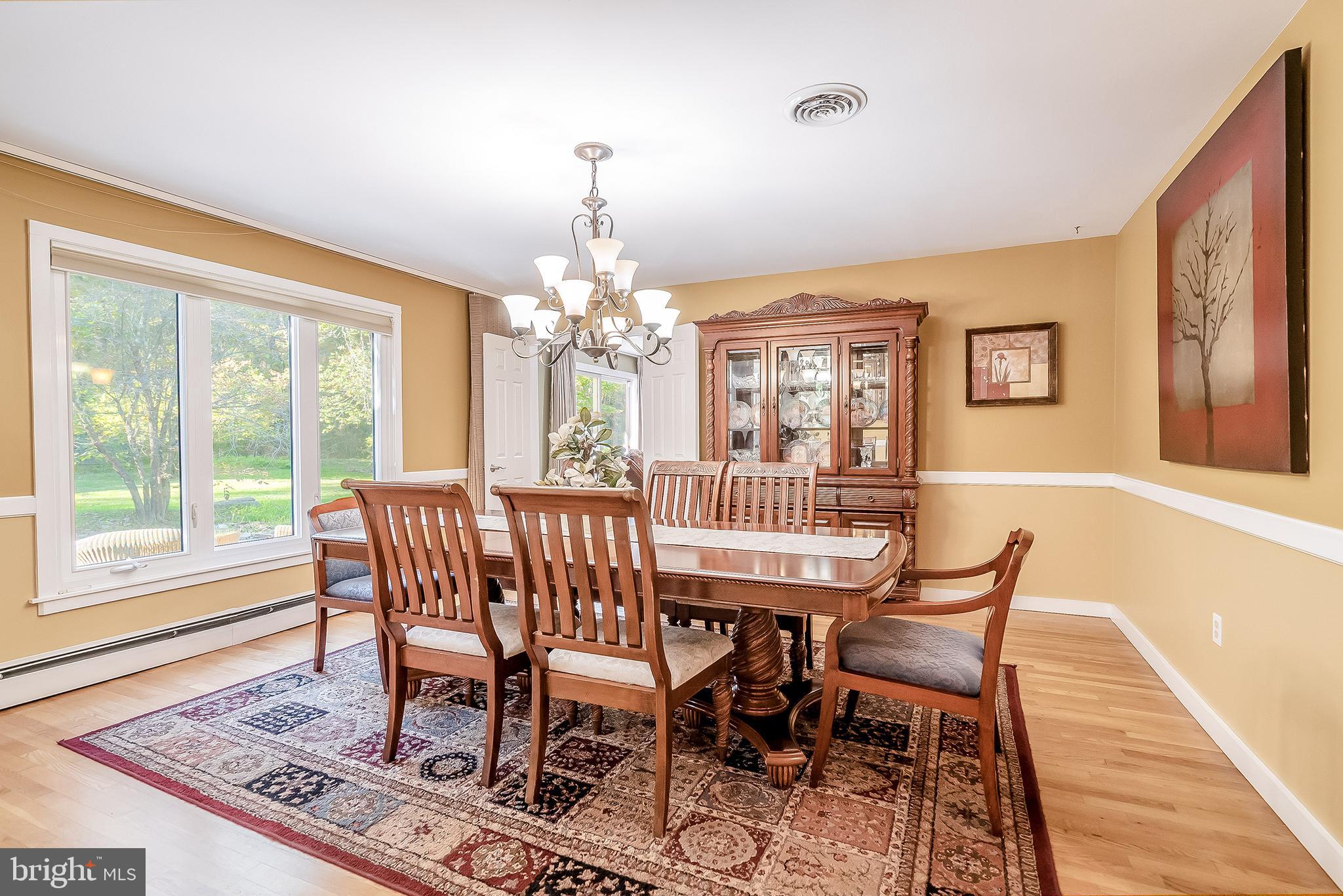 1361 South Leopard Road Berwyn, PA 19312 - Photo 5 of 33 a view of a dining room with furniture a chandelier and wooden floor