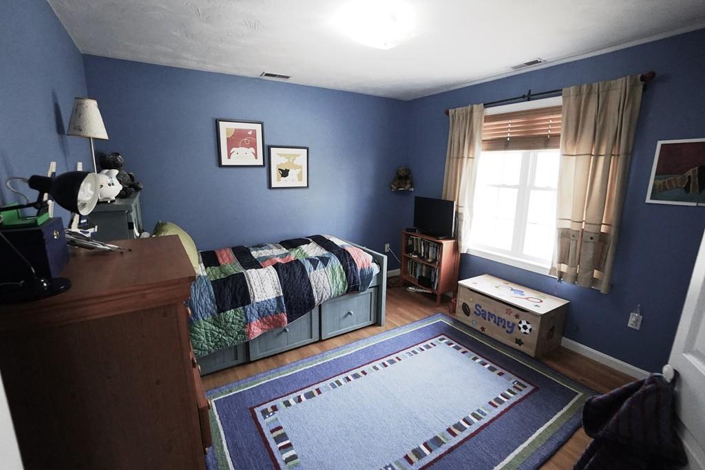 2 Dodge Road Marblehead, MA 01945 - Photo 11 of 16 a bedroom with a bed and wooden floor
