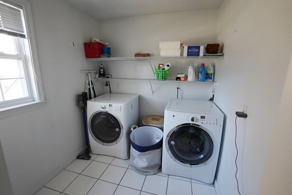 2 Dodge Road Marblehead, MA 01945 - Photo 12 of 16 a view of washer and dryer in a small kitchen