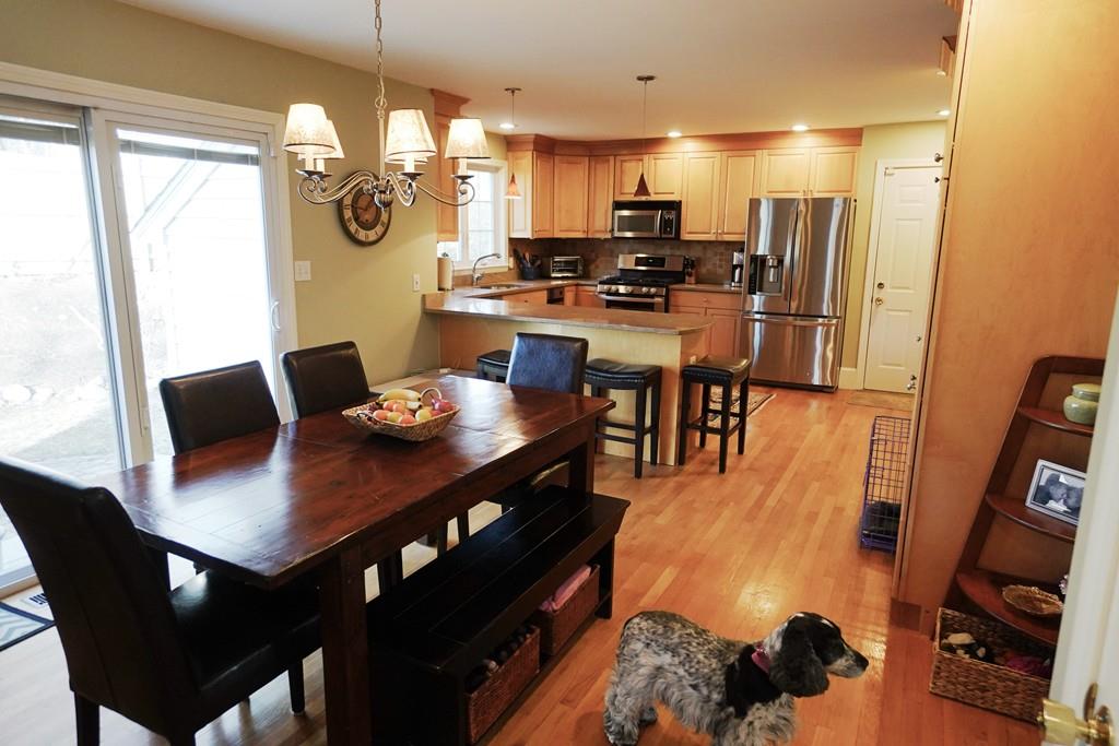 2 Dodge Road Marblehead, MA 01945 - Photo 3 of 16 a kitchen with stainless steel appliances a dining table and chairs