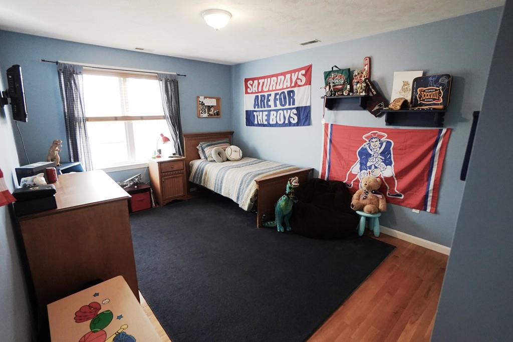 2 Dodge Road Marblehead, MA 01945 - Photo 10 of 16 a bed room with a bed and a couch
