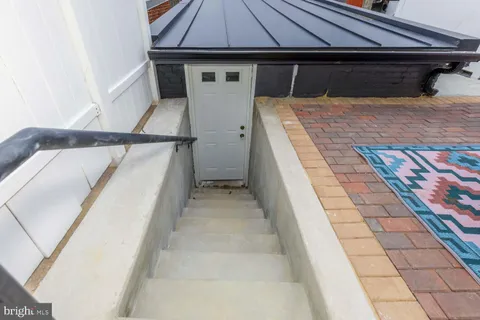 a view of a balcony with furniture