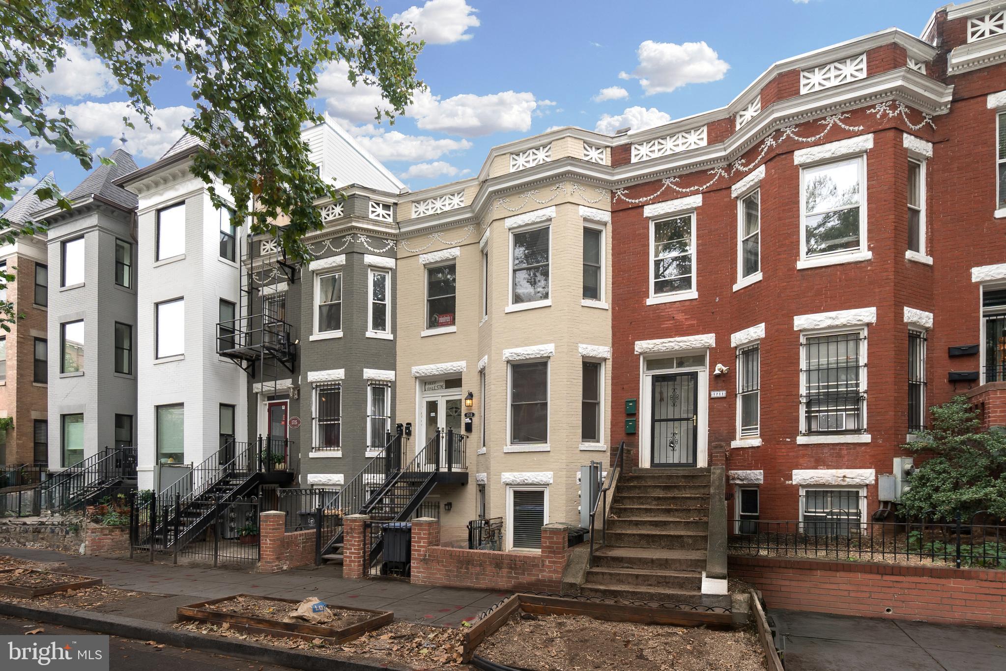 1713 Euclid Street Northwest, Unit 1 Washington, DC 20009 - Photo 1 of 27 a front view of a brick building with many windows
