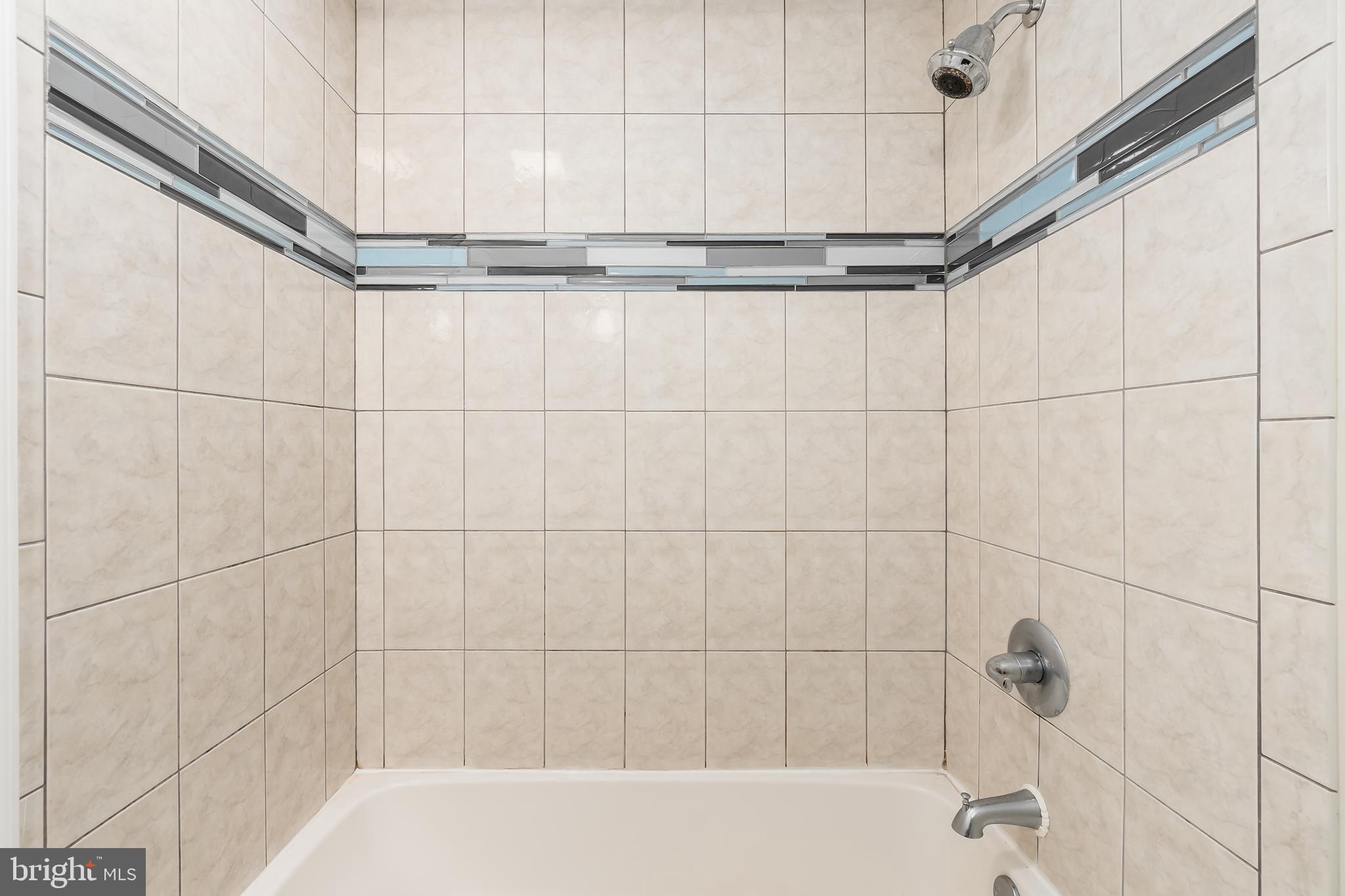 1713 Euclid Street Northwest, Unit 1 Washington, DC 20009 - Photo 13 of 27 a bathroom with a bathtub