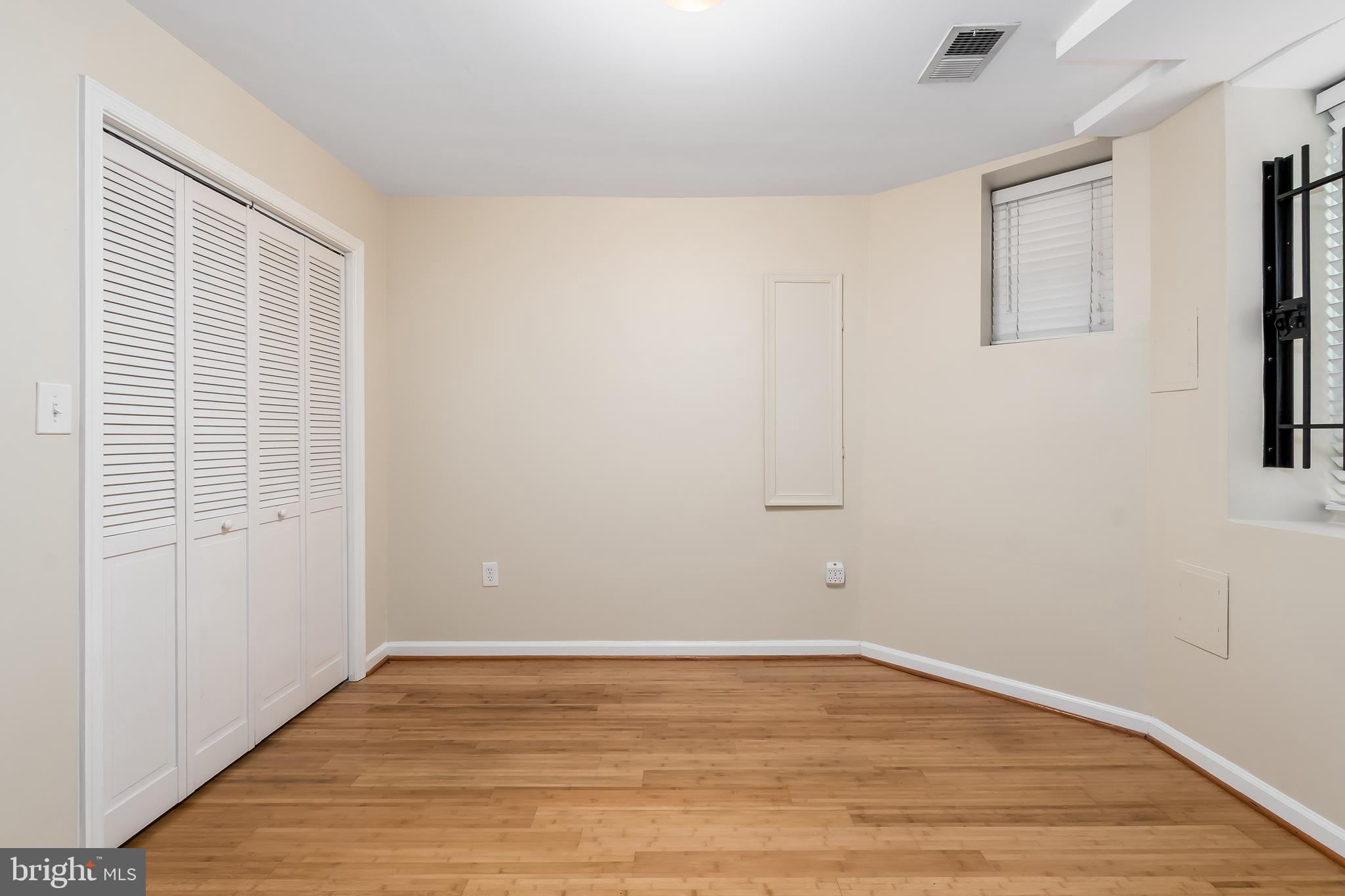 1713 Euclid Street Northwest, Unit 1 Washington, DC 20009 - Photo 16 of 27 wooden floor in an empty room