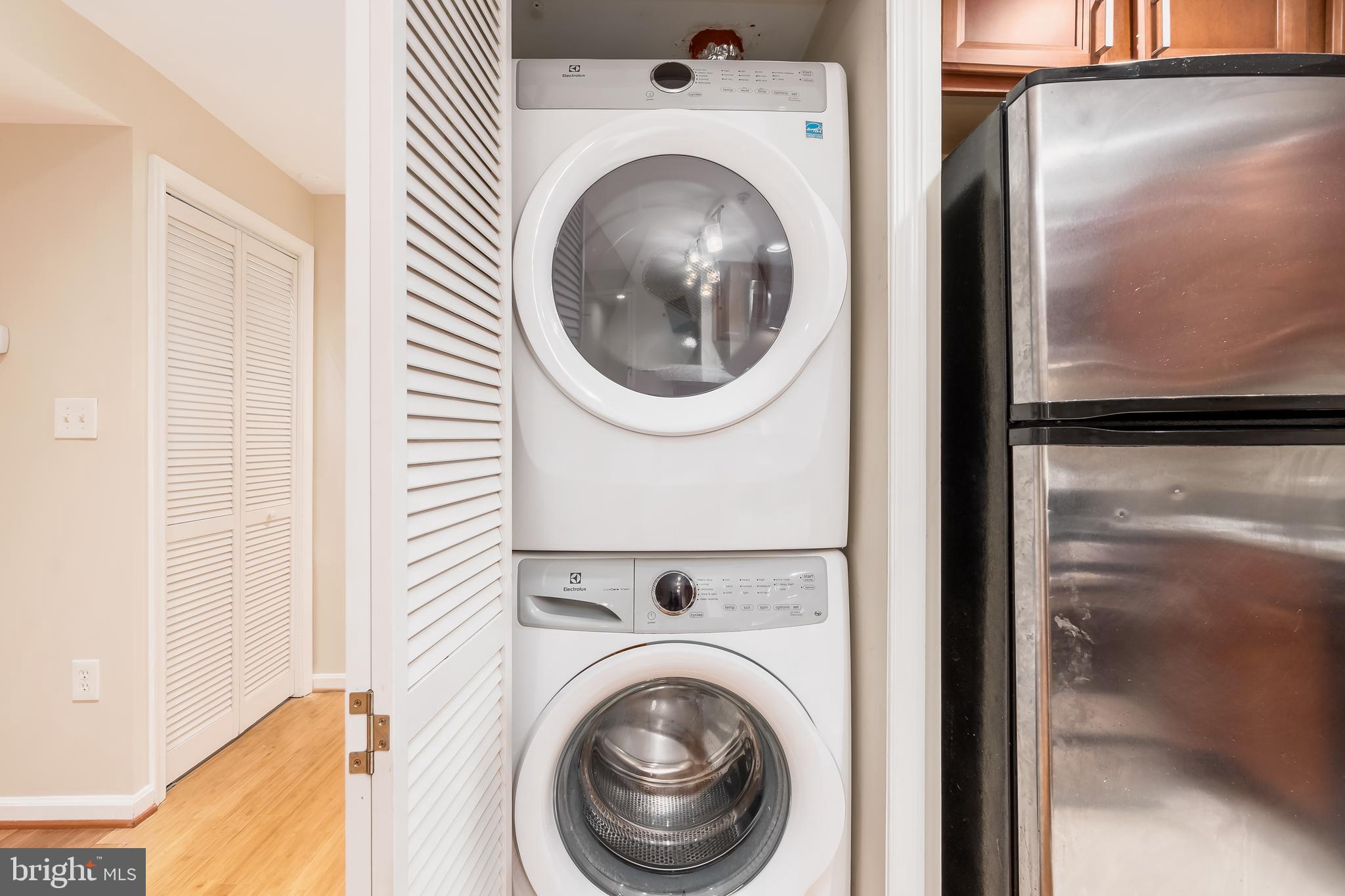 1713 Euclid Street Northwest, Unit 1 Washington, DC 20009 - Photo 23 of 27 a view of a hallway with washer and dryer