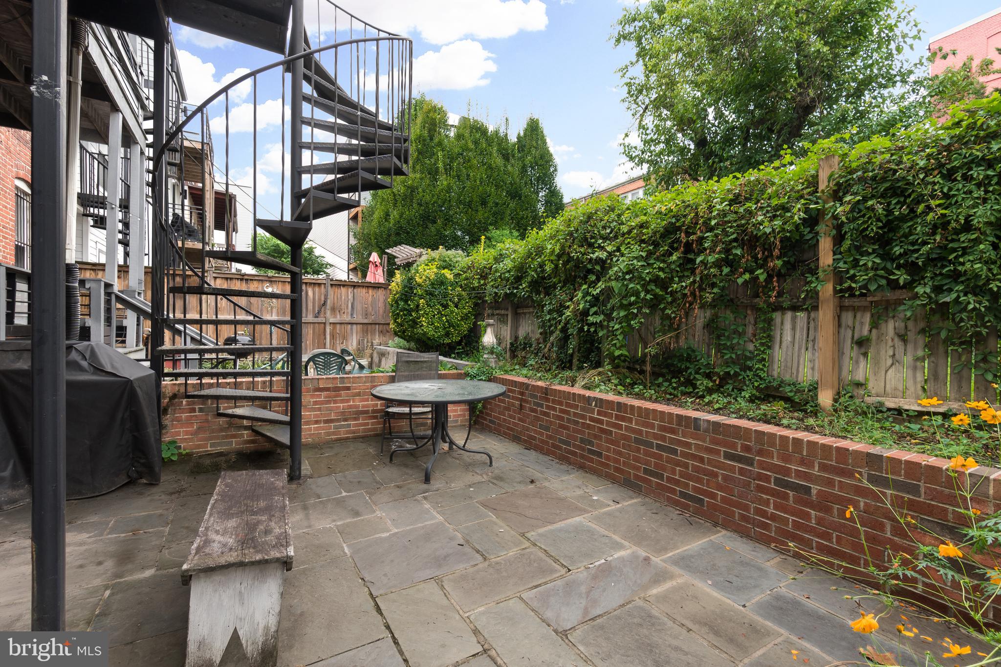 1713 Euclid Street Northwest, Unit 1 Washington, DC 20009 - Photo 25 of 27 a view of a bench in a patio