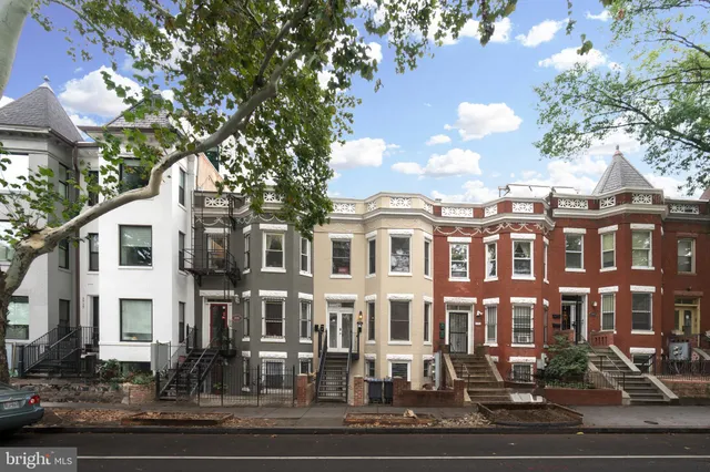 a front view of a building with street view