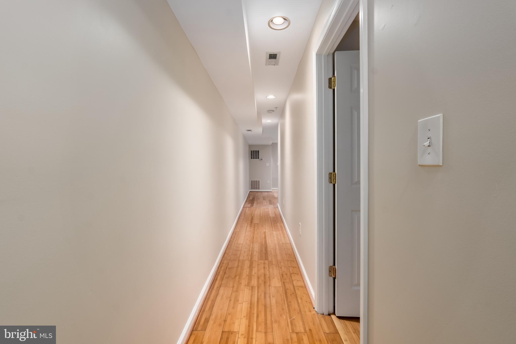 1713 Euclid Street Northwest, Unit 1 Washington, DC 20009 - Photo 2 of 27 a view of a hallway with wooden floor