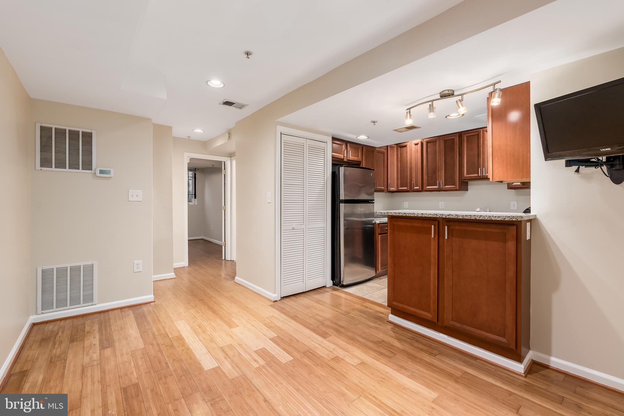 1713 Euclid Street Northwest, Unit 1 Washington, DC 20009 - Photo 7 of 27 a view of kitchen with wooden floor