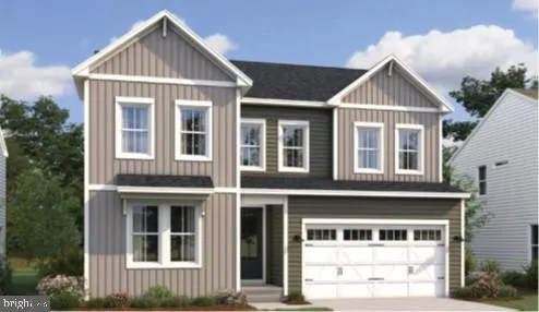 a view of a brick house with large windows