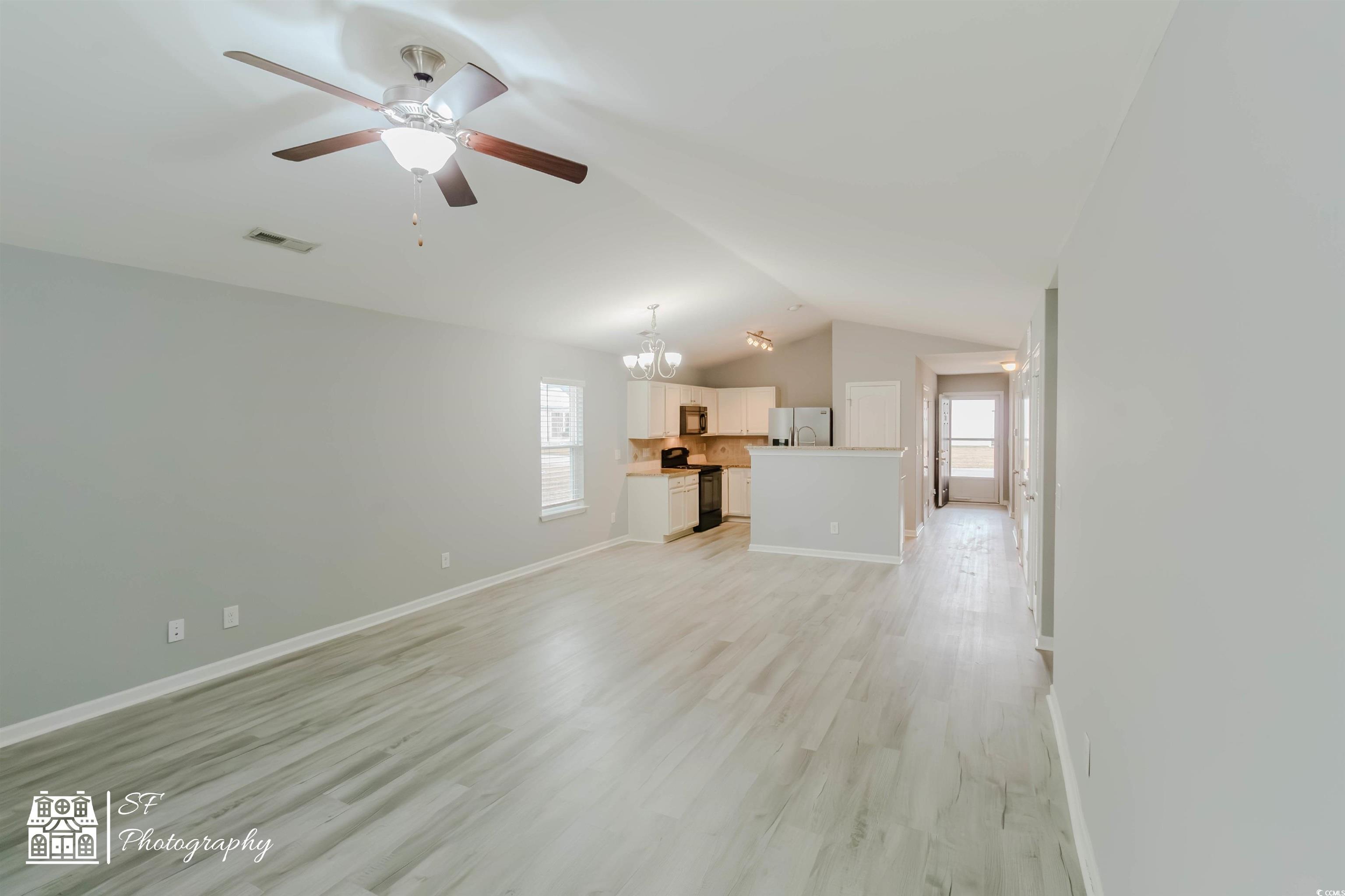 290 Blue Rock Drive Longs, SC 29568 - Photo 12 of 21 Unfurnished living room featuring ceiling fan with