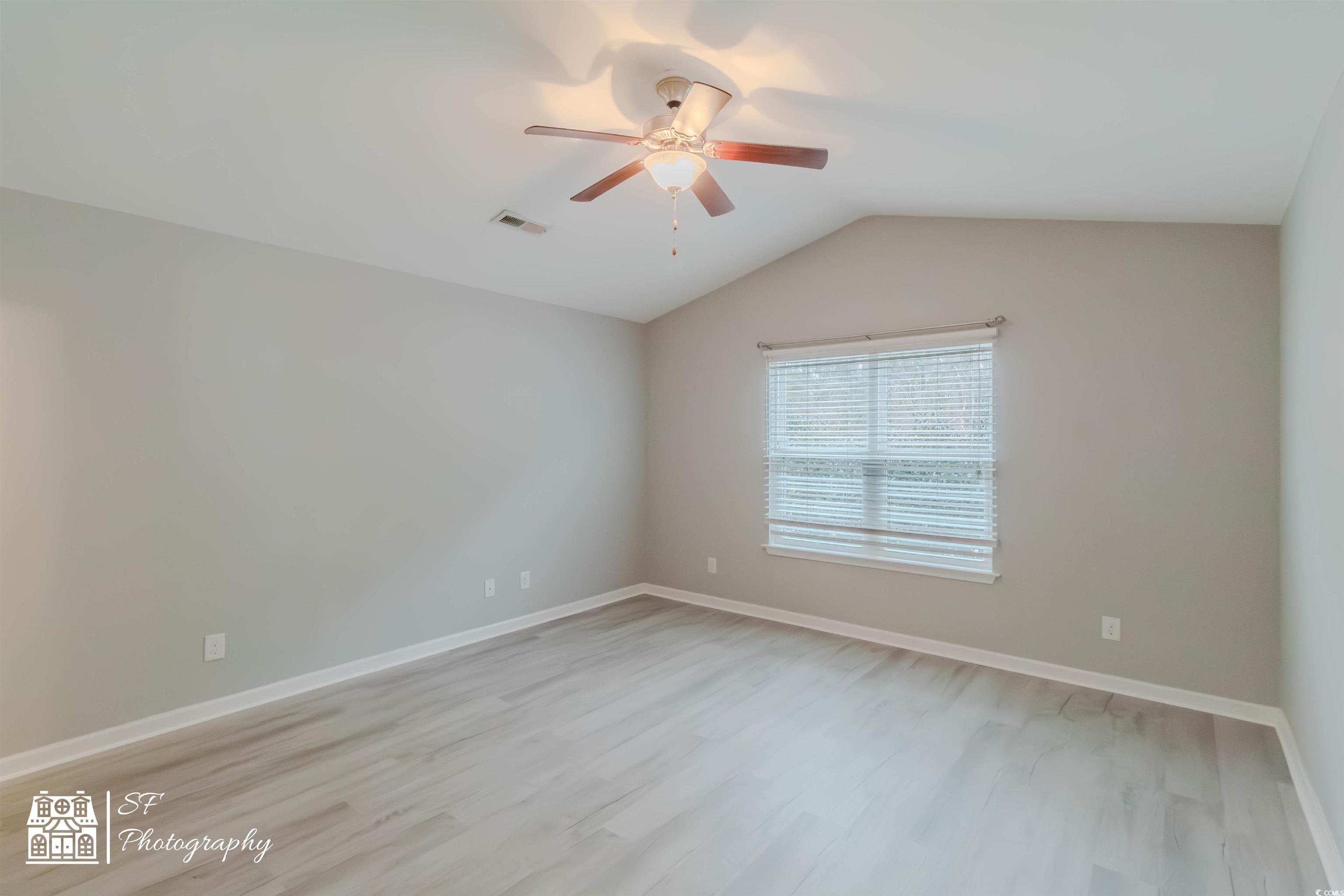 290 Blue Rock Drive Longs, SC 29568 - Photo 13 of 21 Empty room featuring ceiling fan, lofted ceiling,