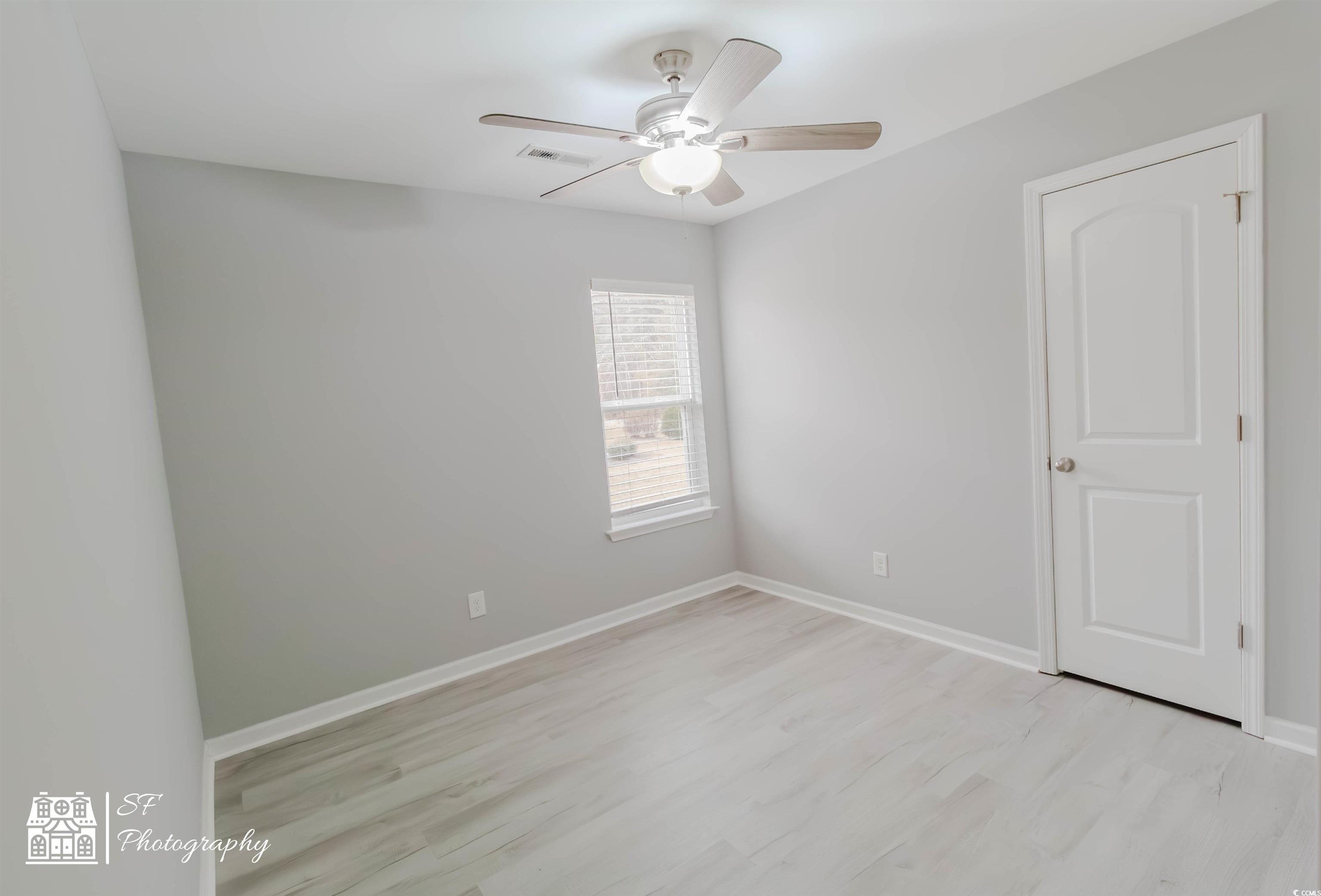 290 Blue Rock Drive Longs, SC 29568 - Photo 8 of 21 Spare room featuring ceiling fan and light wood-ty