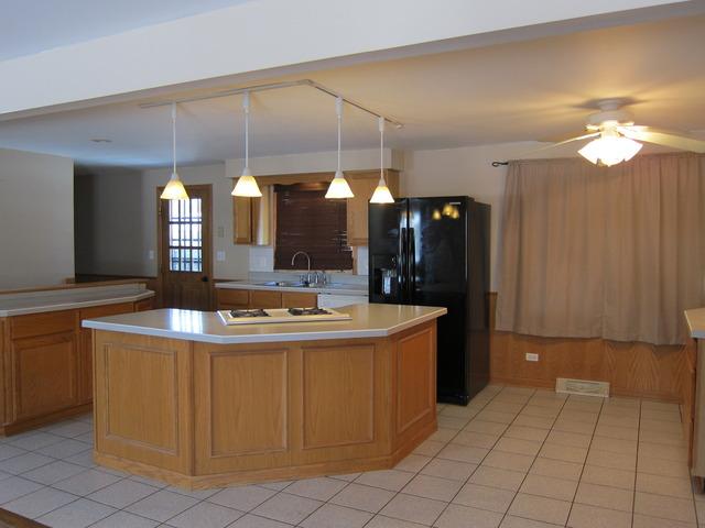 976 Ruth Drive Elgin, IL 60123 - Photo 5 of 15 a view of living room with granite countertop furniture and chandelier