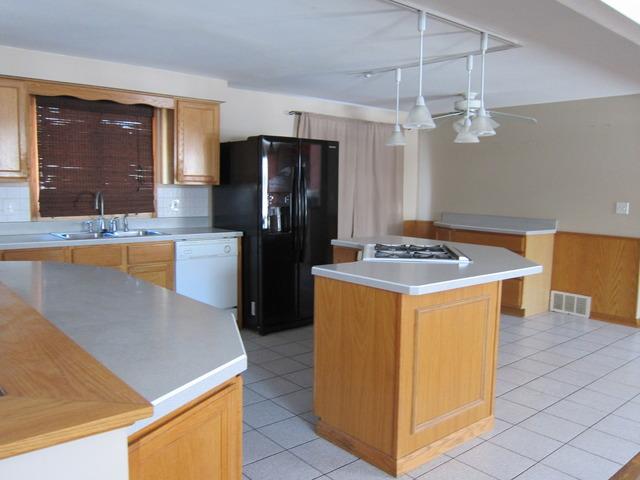 976 Ruth Drive Elgin, IL 60123 - Photo 6 of 15 a kitchen with stainless steel appliances granite countertop a refrigerator a sink and a stove