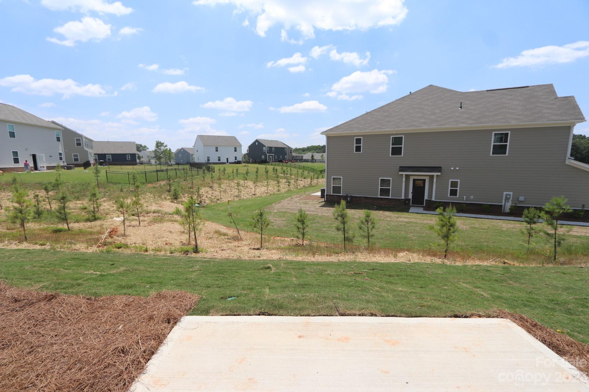 2825 Trinity Street Monroe, NC 28110 - Photo 4 of 6 a view of a house with a yard