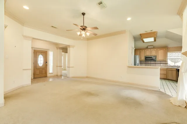 a view of an empty room with a window