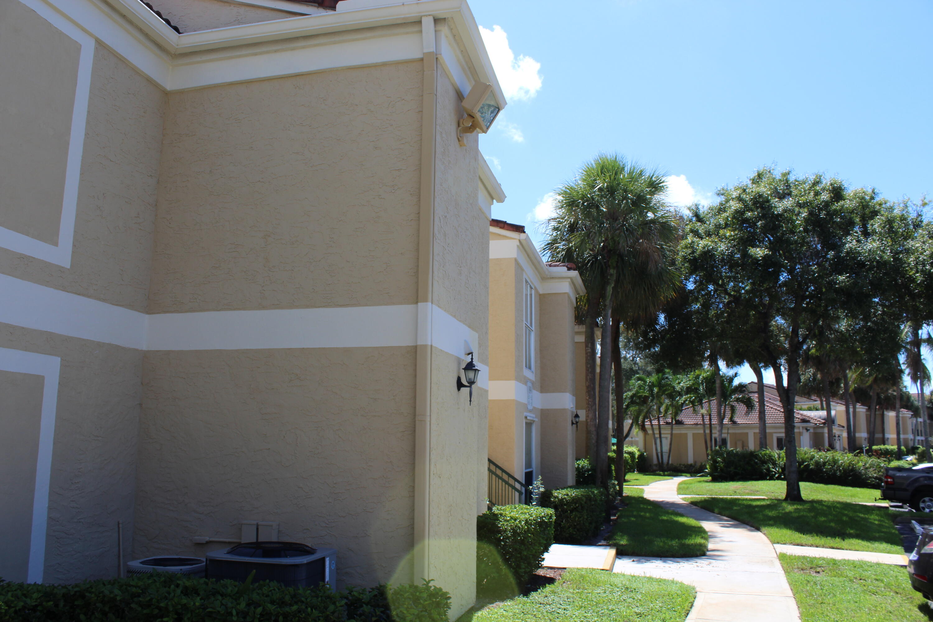 899 Riverside Drive, Unit 620 Coral Springs, FL 33071 - Photo 43 of 46 front view of a house with a yard
