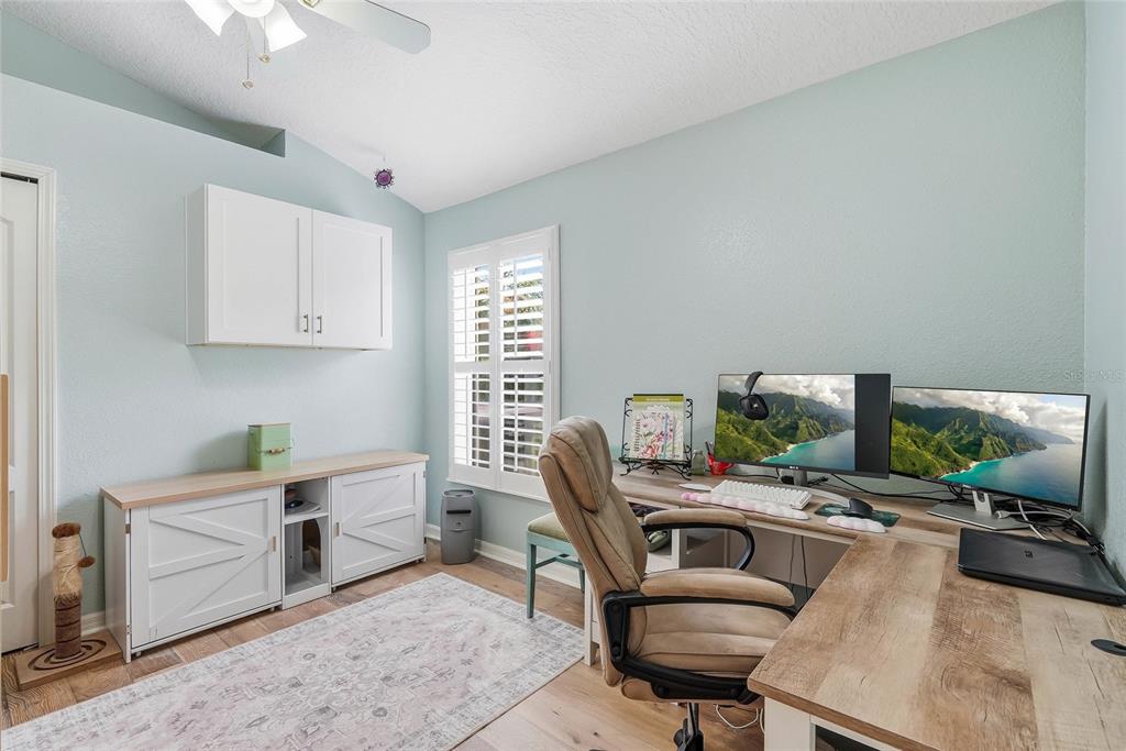 16748 Midsummer Lane Spring Hill, FL 34610 - Photo 31 of 52 a work room with furniture and a potted plant