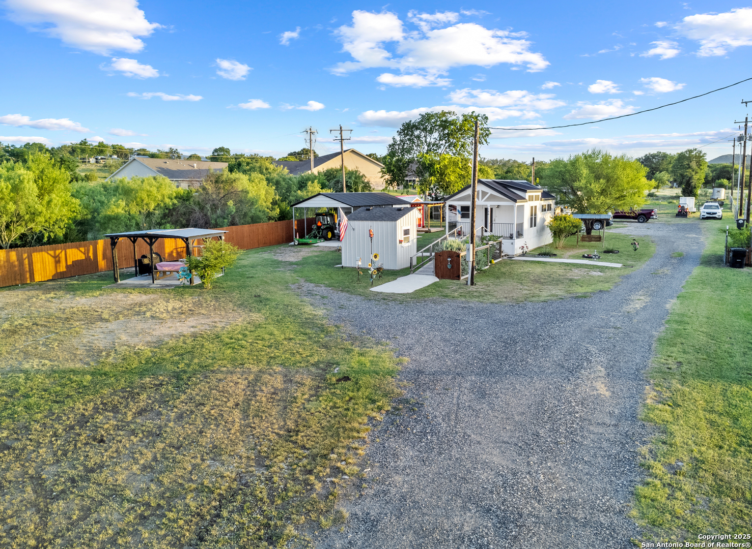 a view of a garden with a house in the background
