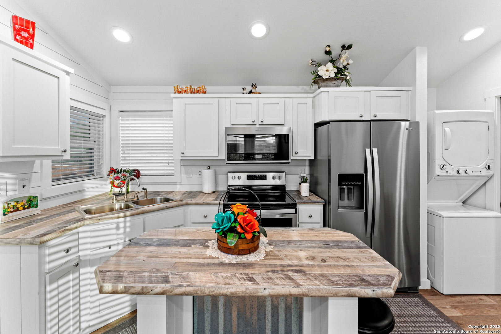 286 Highway 173 Bandera, TX 78003 - Photo 14 of 38 a kitchen with stainless steel appliances granite countertop a sink dishwasher a refrigerator and a stove