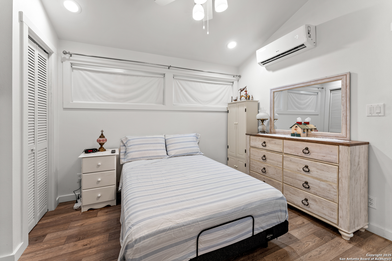 286 Highway 173 Bandera, TX 78003 - Photo 16 of 38 a bedroom with a bed and a dresser