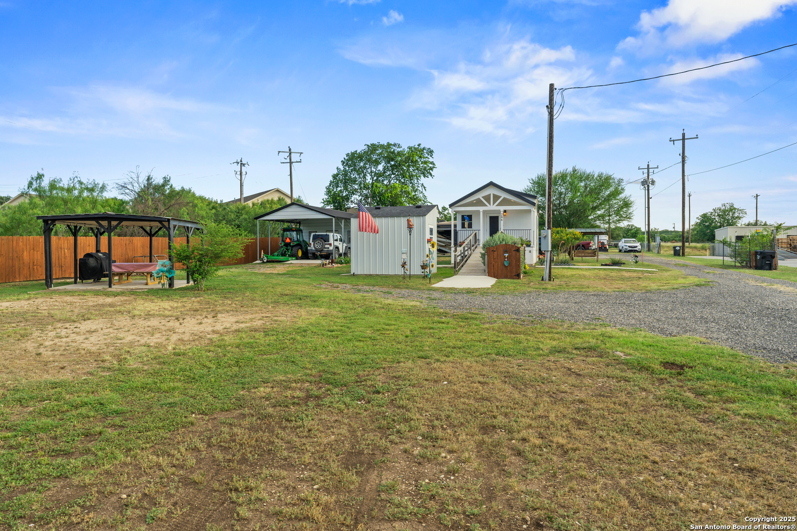 286 Highway 173 Bandera, TX 78003 - Photo 20 of 38 a front view of a house with a yard