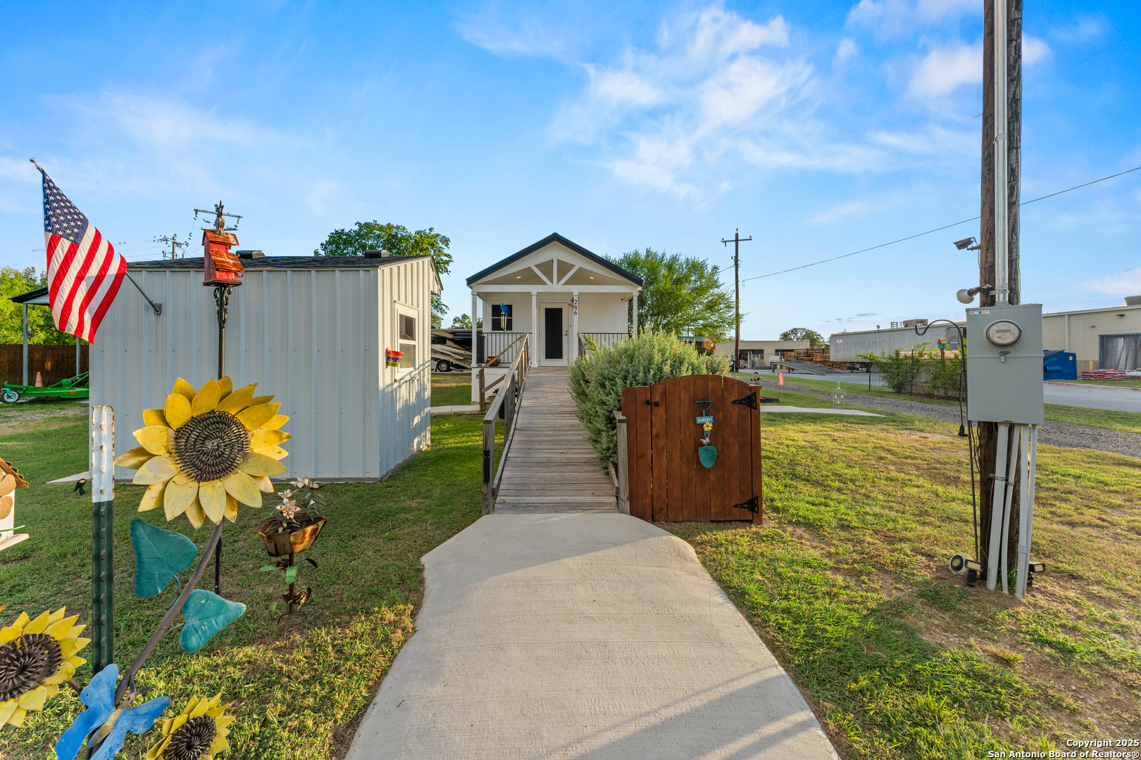 286 Highway 173 Bandera, TX 78003 - Photo 2 of 38 a house view with a garden space