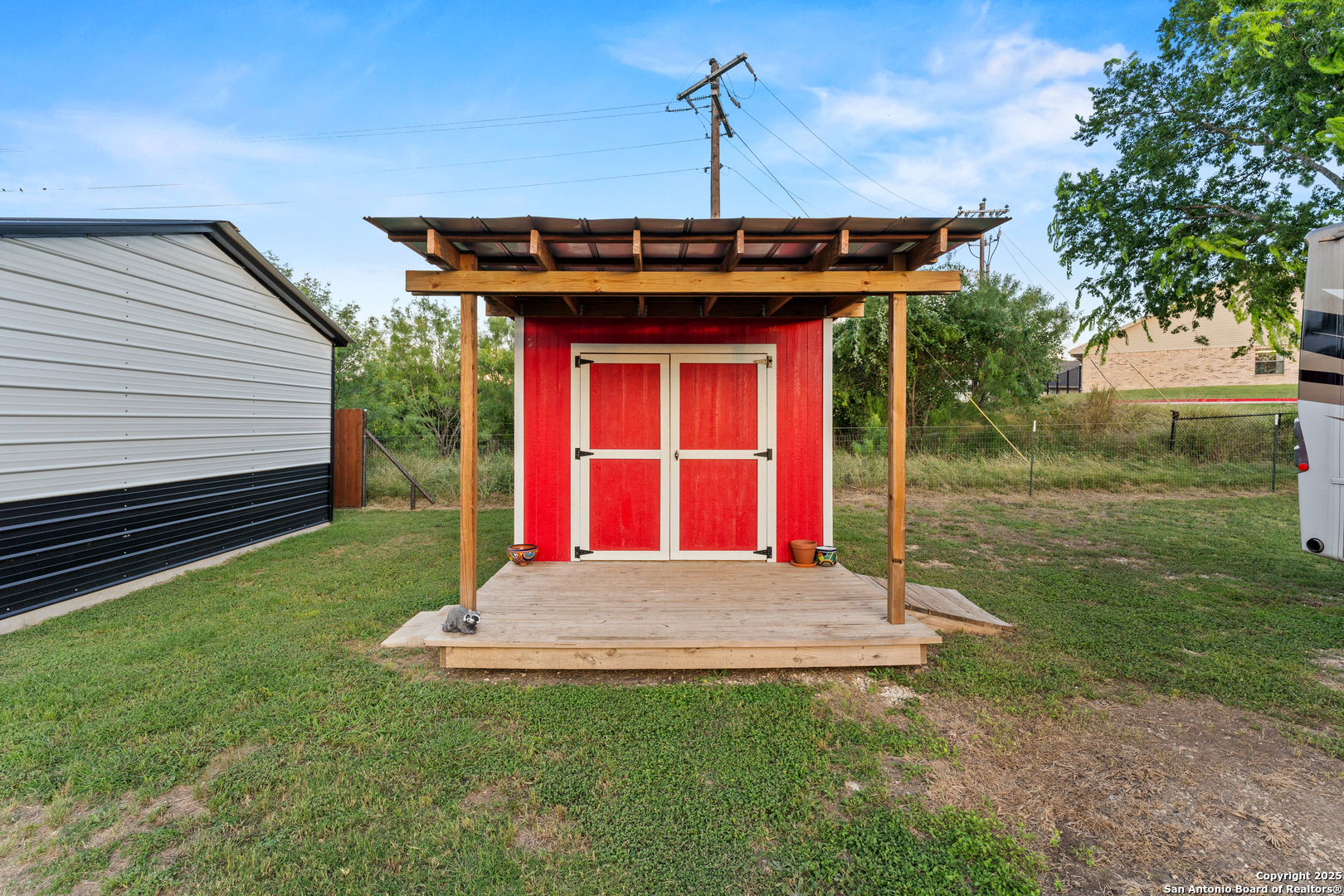 286 Highway 173 Bandera, TX 78003 - Photo 24 of 38 a view of a house with a yard