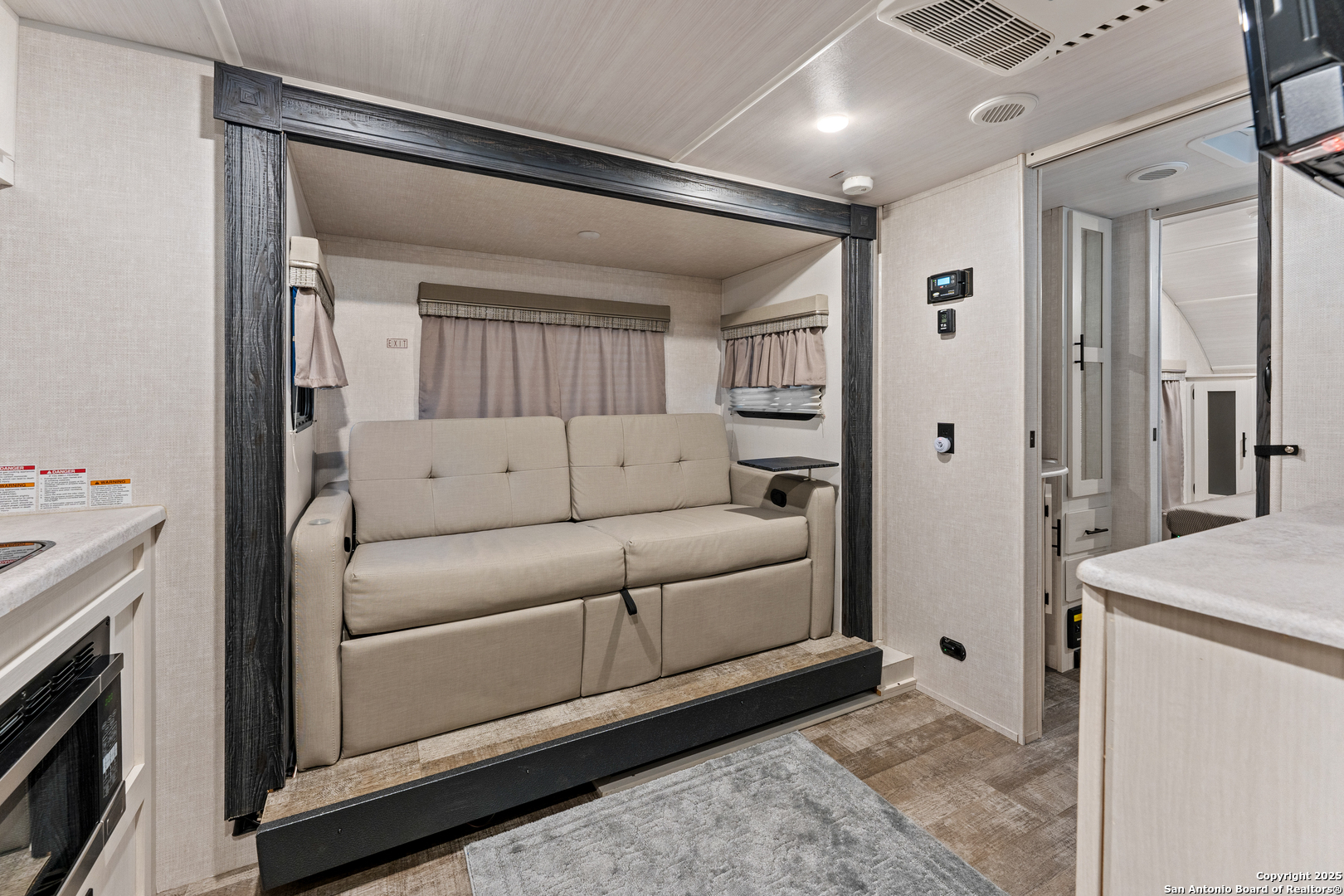 286 Highway 173 Bandera, TX 78003 - Photo 32 of 38 a living room with furniture and a fireplace