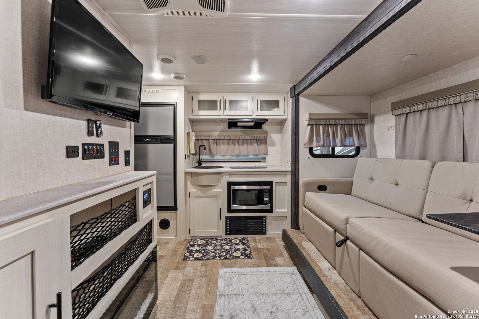286 Highway 173 Bandera, TX 78003 - Photo 33 of 38 a kitchen with stainless steel appliances kitchen island granite countertop a stove and a refrigerator