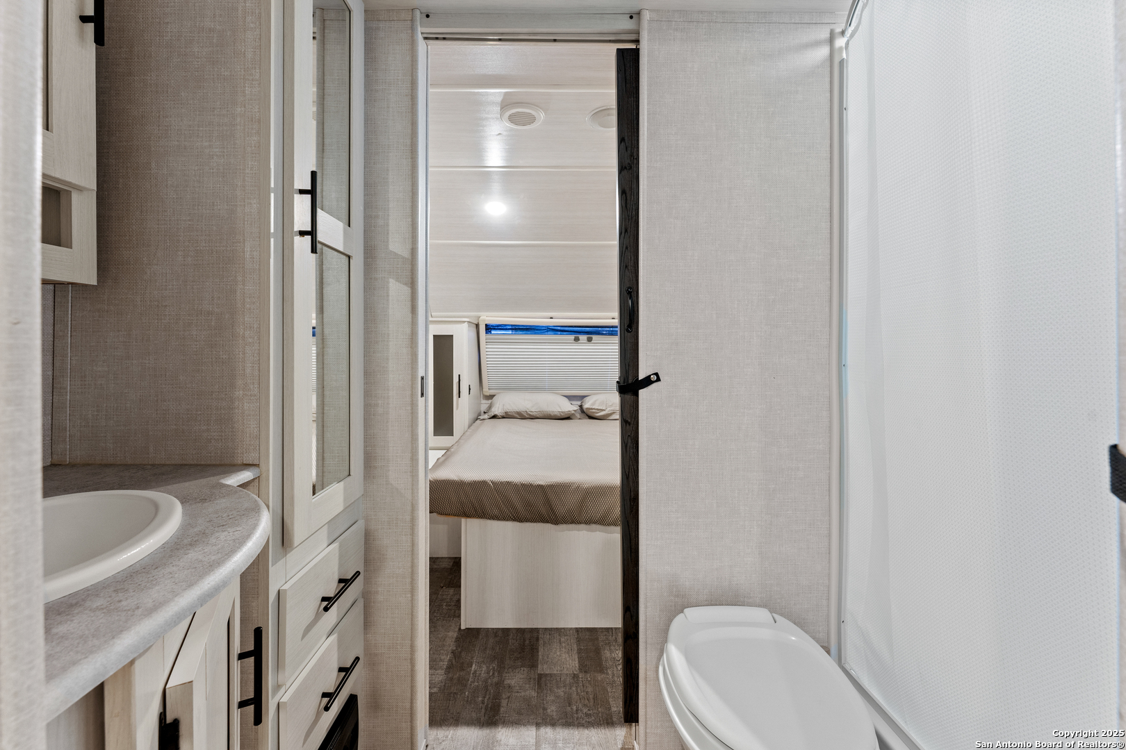 286 Highway 173 Bandera, TX 78003 - Photo 34 of 38 a bathroom with a sink a toilet and shower