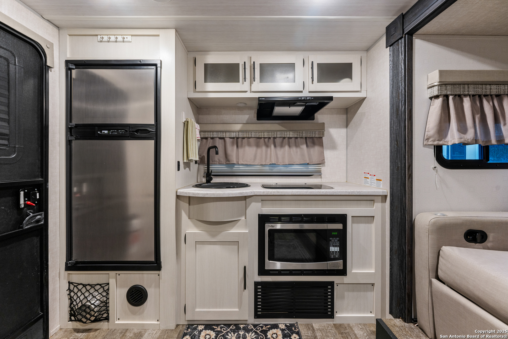 286 Highway 173 Bandera, TX 78003 - Photo 36 of 38 a kitchen with stainless steel appliances granite countertop a refrigerator and a stove