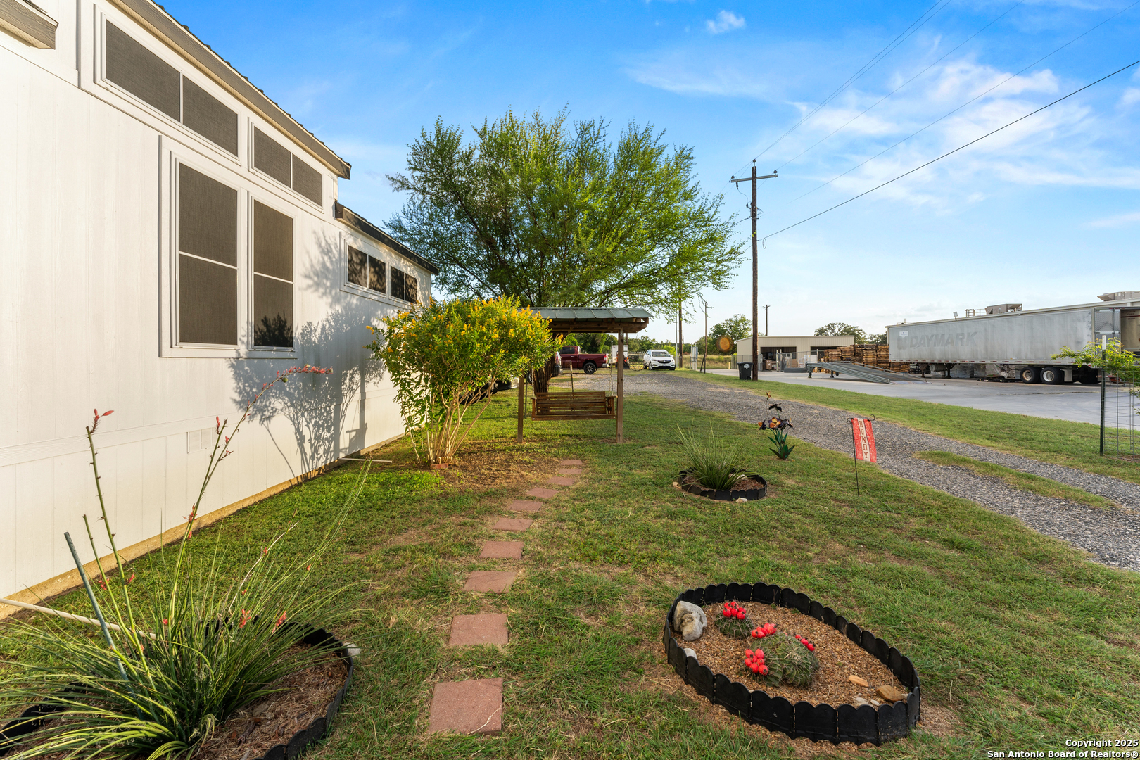 286 Highway 173 Bandera, TX 78003 - Photo 4 of 38 a backyard of a house with table and chairs