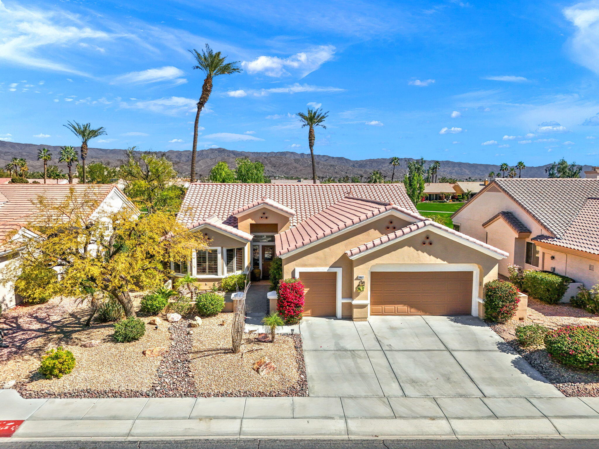 39611 Manorgate Road Palm Desert, CA 92211 - Photo 1 of 45 a front view of a house with a yard