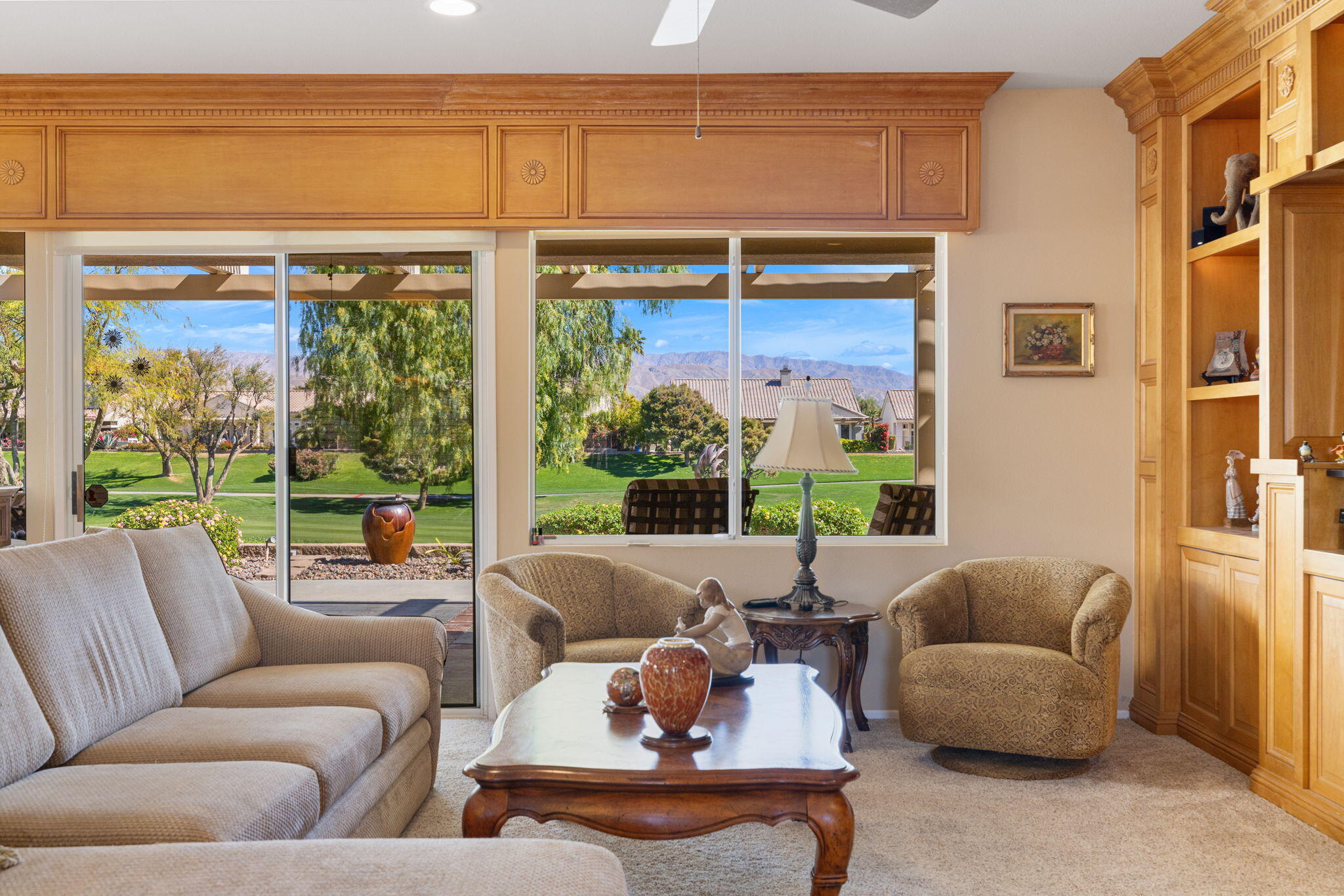 39611 Manorgate Road Palm Desert, CA 92211 - Photo 11 of 45 a living room with furniture and a large window