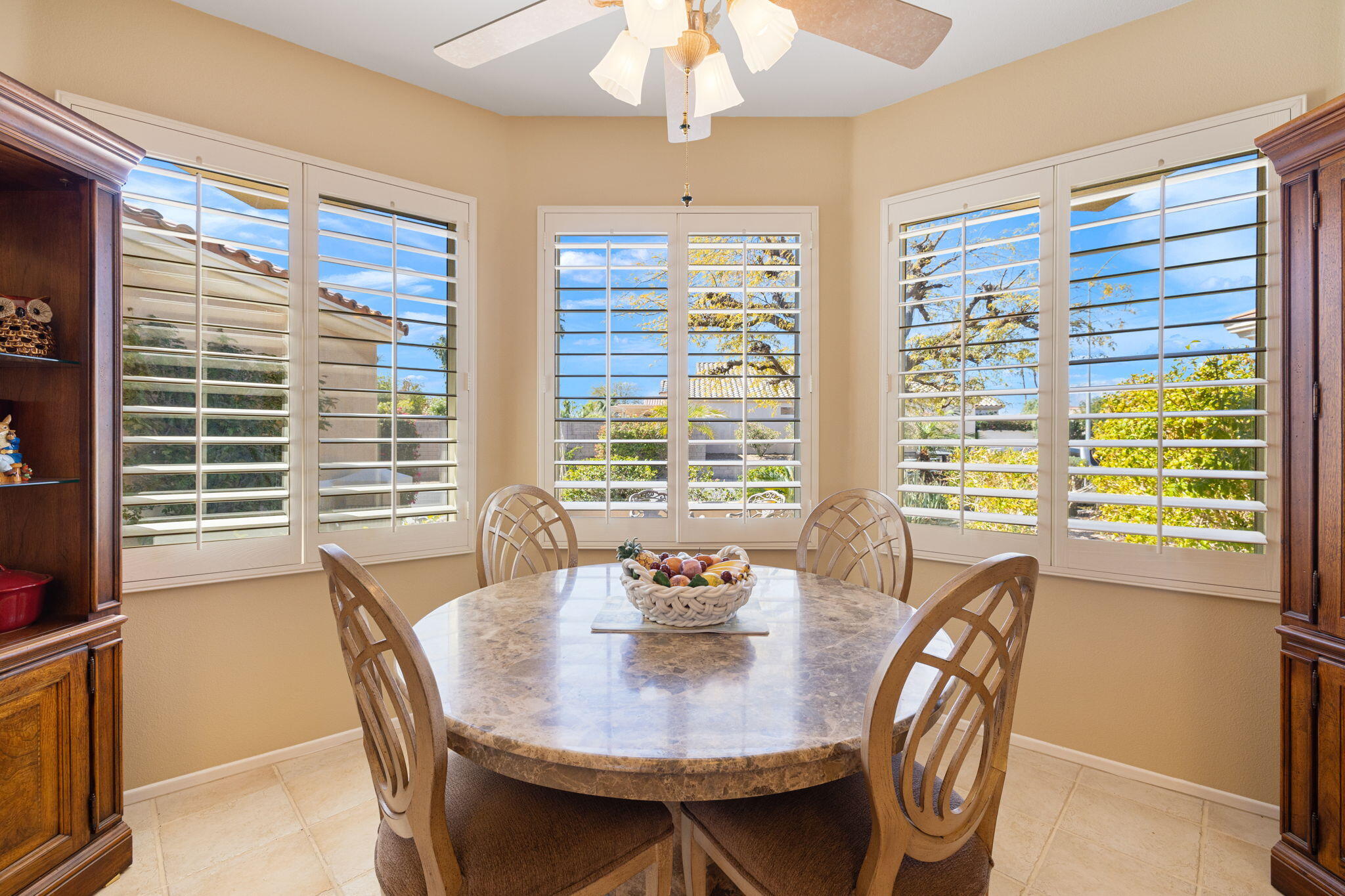 39611 Manorgate Road Palm Desert, CA 92211 - Photo 19 of 45 a view of a dining room with furniture window and outside view