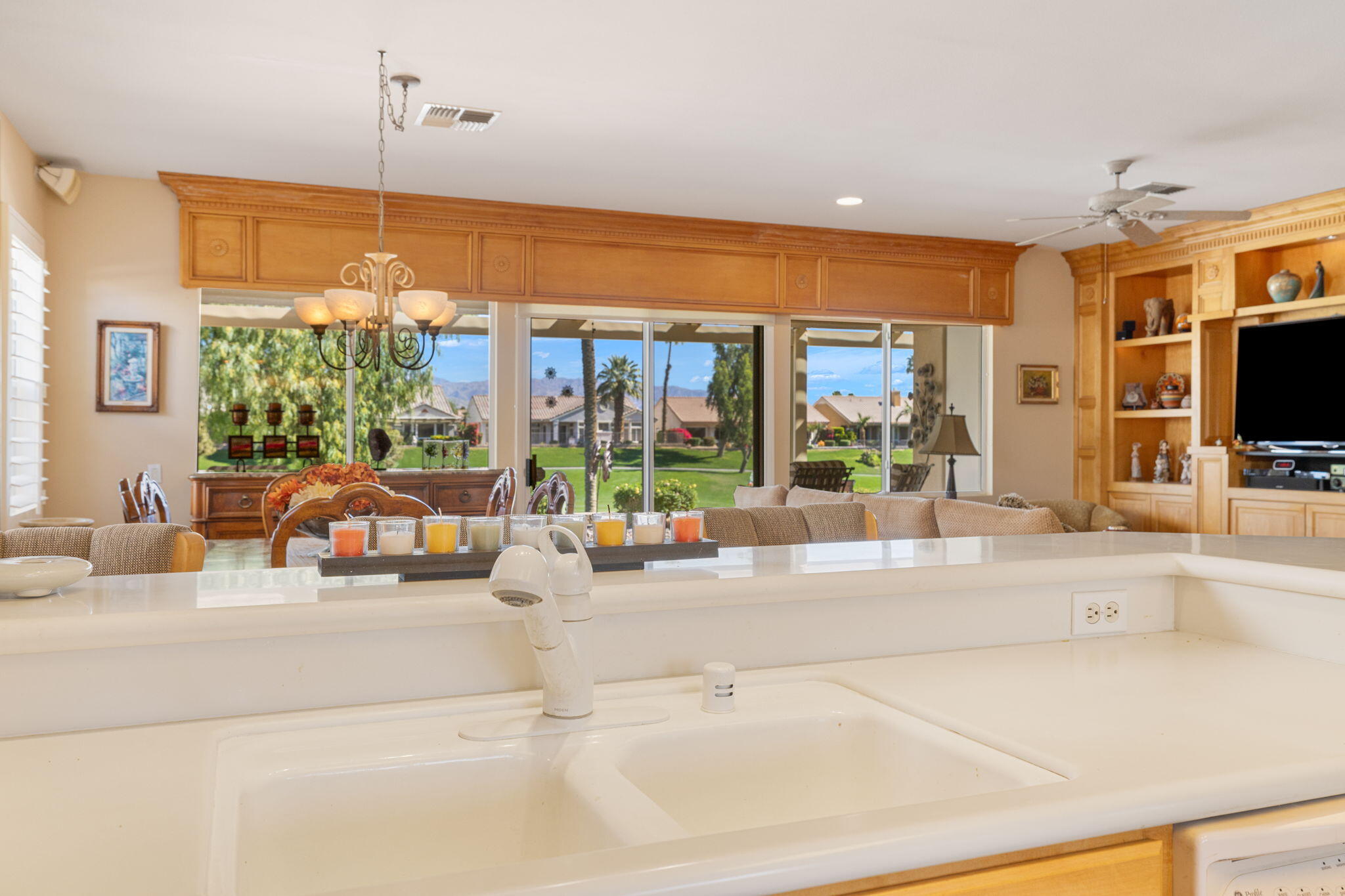 39611 Manorgate Road Palm Desert, CA 92211 - Photo 20 of 45 a living room with furniture and large windows