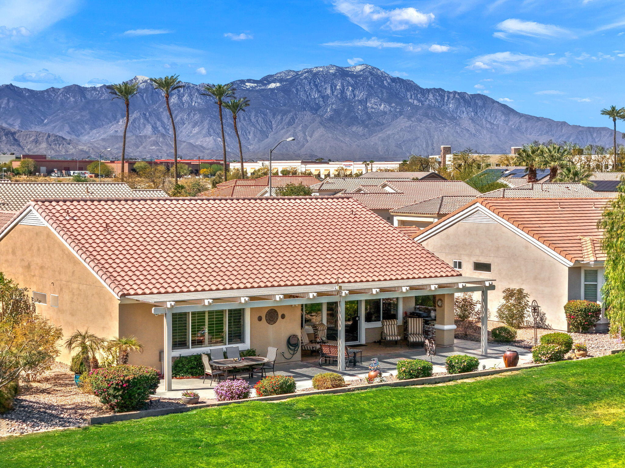 39611 Manorgate Road Palm Desert, CA 92211 - Photo 25 of 45 a front view of house with yard and outdoor seating