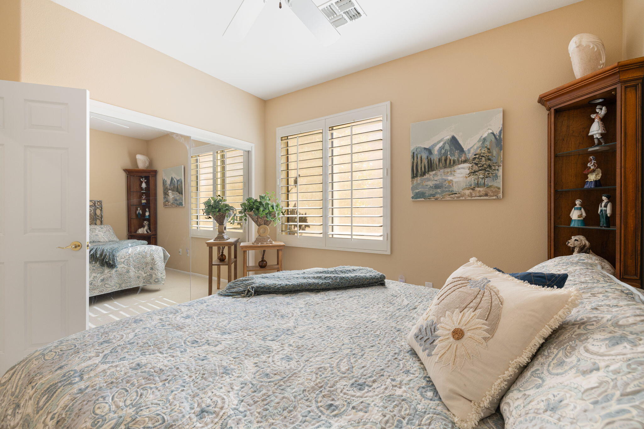 39611 Manorgate Road Palm Desert, CA 92211 - Photo 27 of 45 a bedroom with a bed couch and a window
