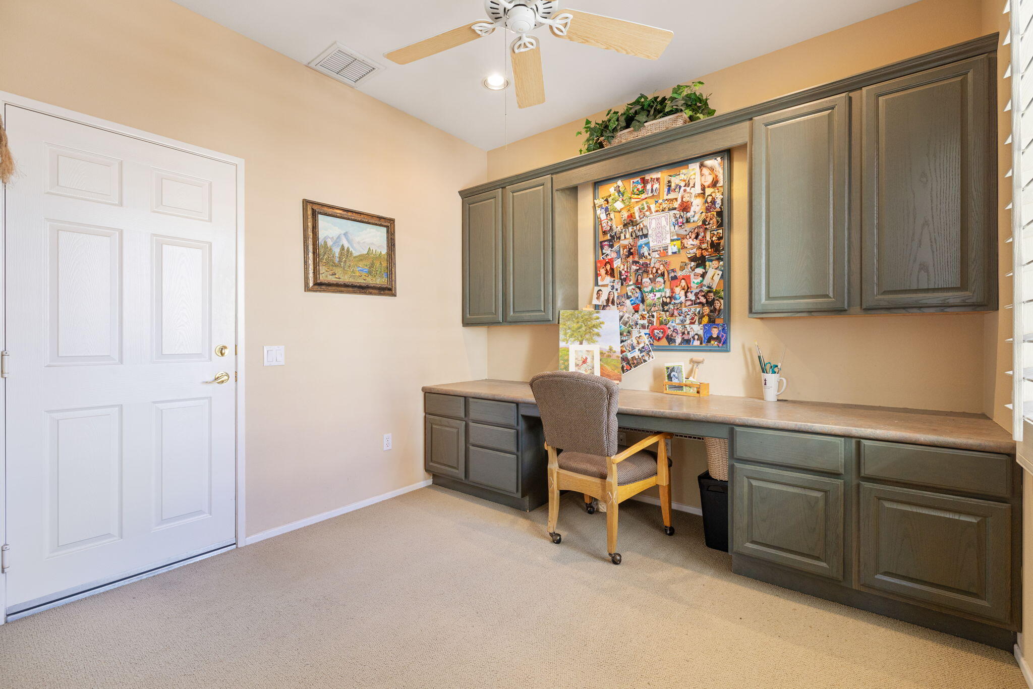 39611 Manorgate Road Palm Desert, CA 92211 - Photo 30 of 45 a view of a workspace with furniture and a window