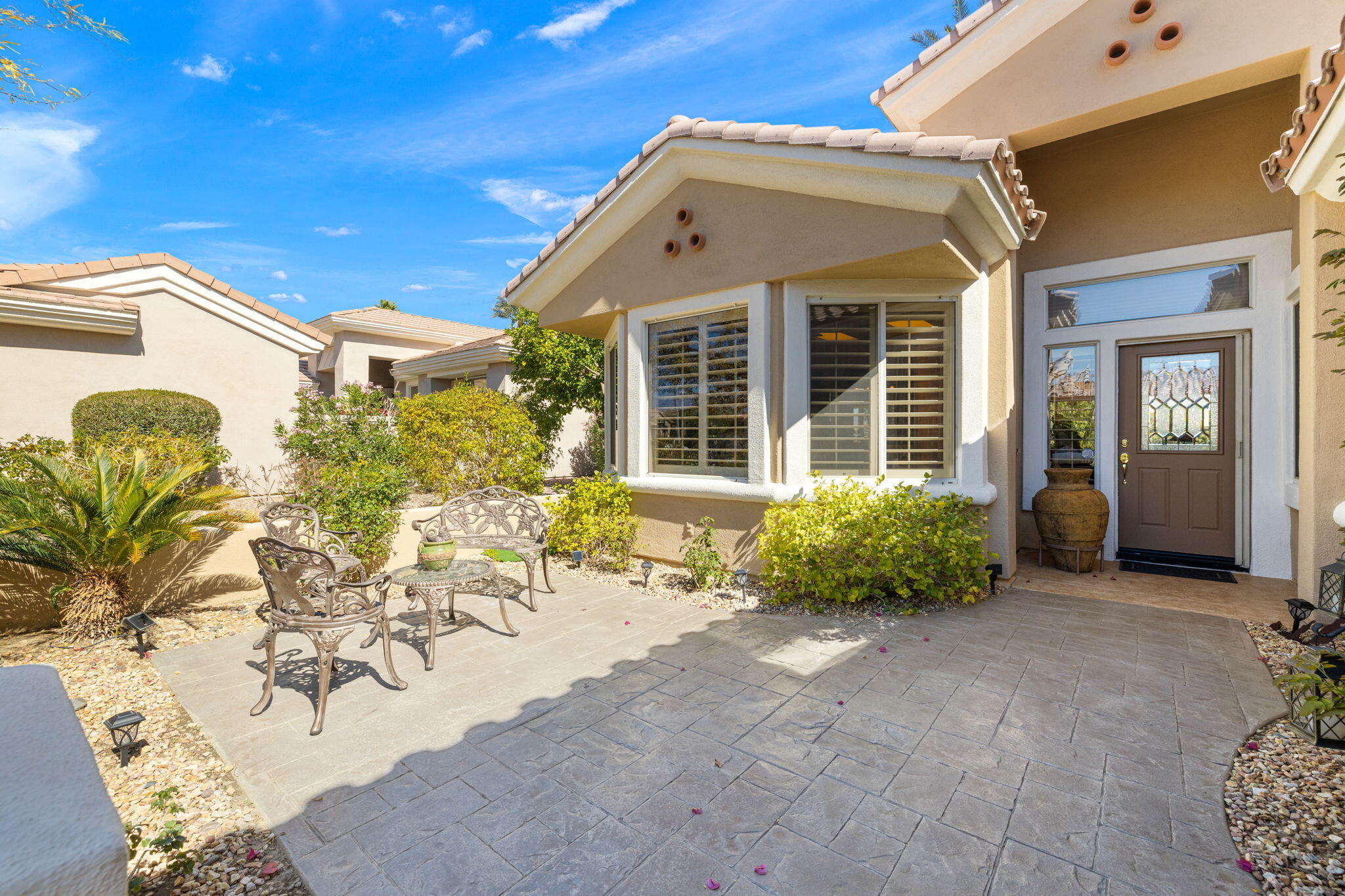 39611 Manorgate Road Palm Desert, CA 92211 - Photo 3 of 45 a front view of a house with patio