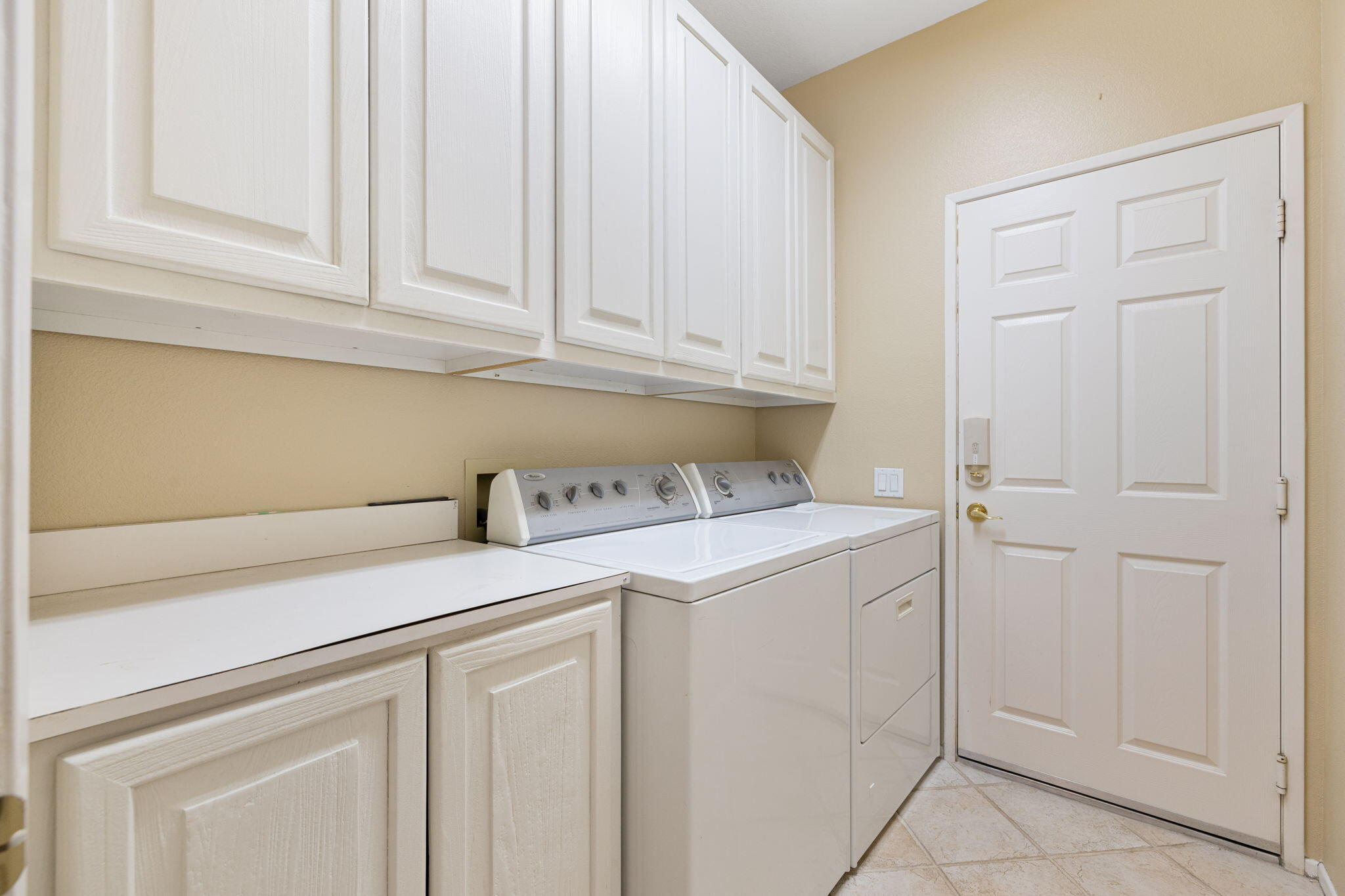 39611 Manorgate Road Palm Desert, CA 92211 - Photo 32 of 45 a utility room with dryer and washer