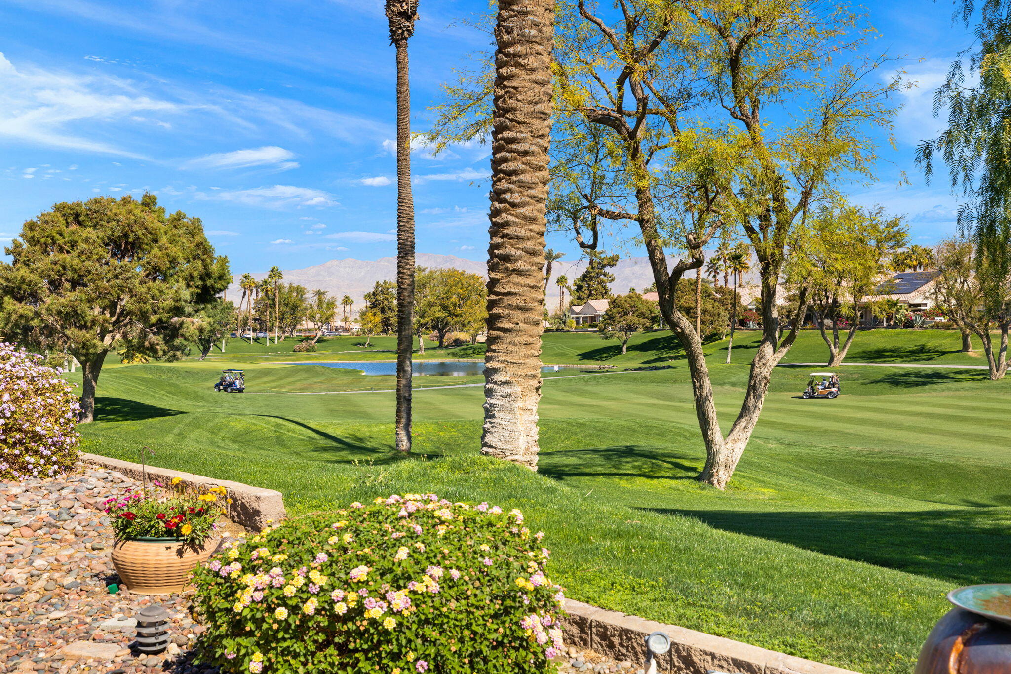 39611 Manorgate Road Palm Desert, CA 92211 - Photo 40 of 45 a view of a park with swings and slides