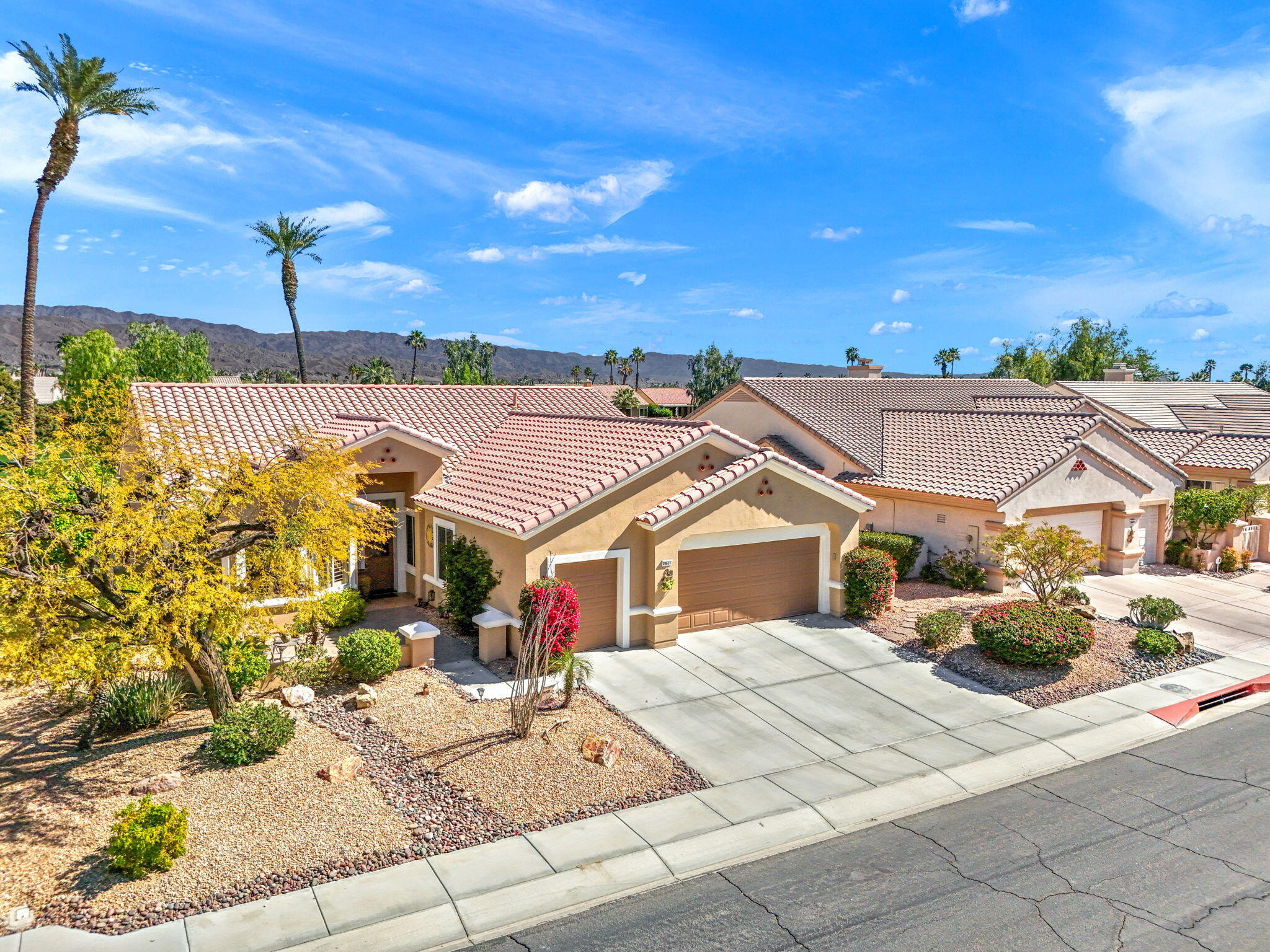 39611 Manorgate Road Palm Desert, CA 92211 - Photo 43 of 45 a view of a house with swimming pool and sitting area