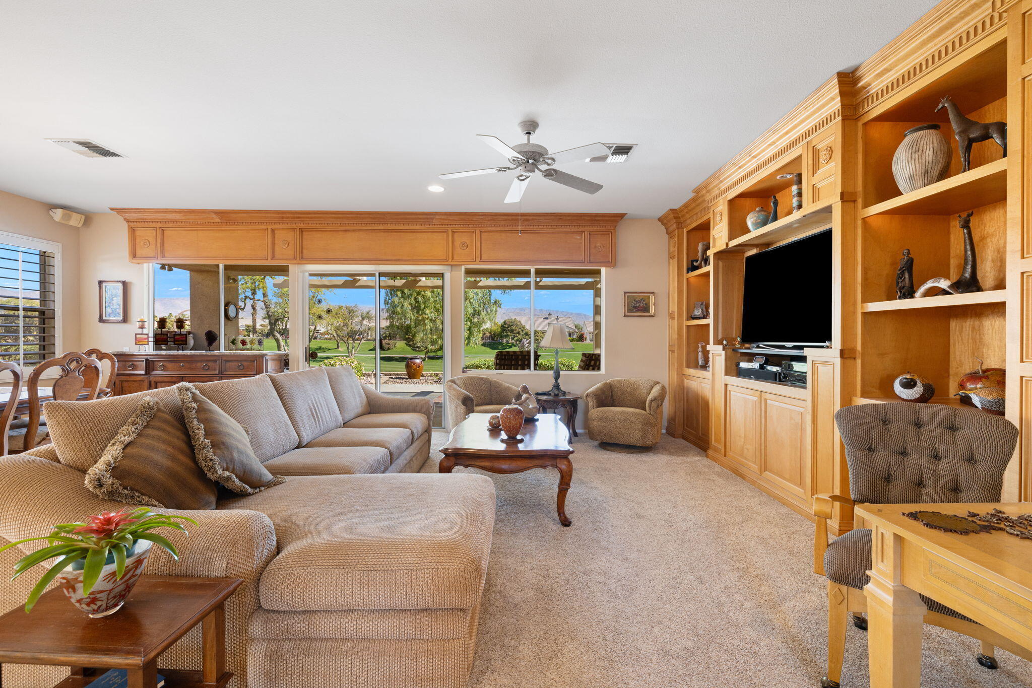 39611 Manorgate Road Palm Desert, CA 92211 - Photo 7 of 45 a living room with furniture tv and a flat screen tv