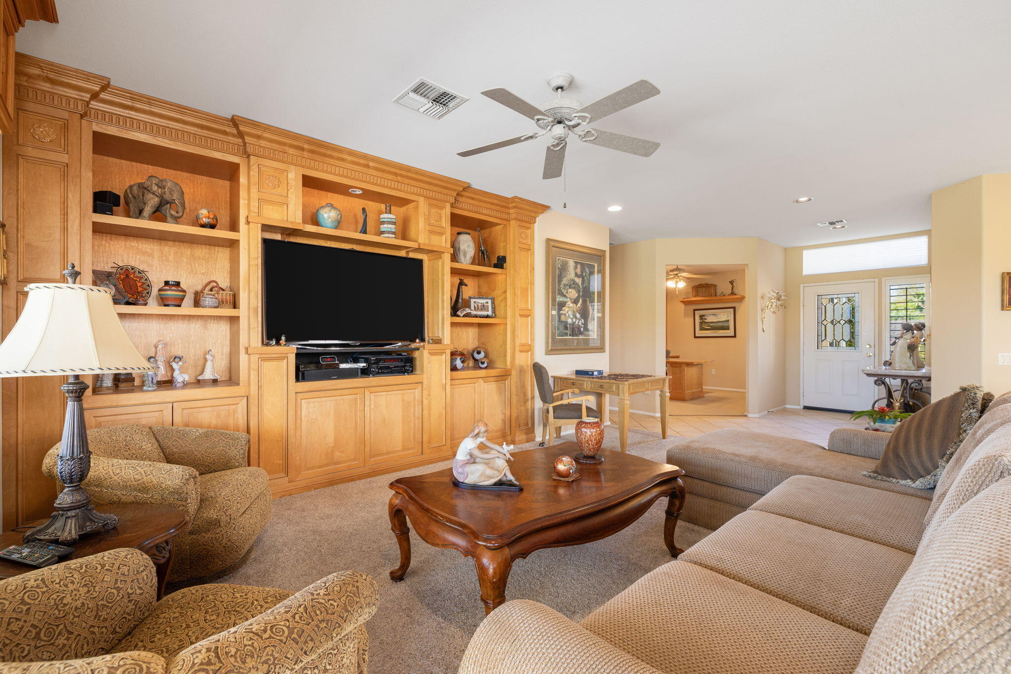 39611 Manorgate Road Palm Desert, CA 92211 - Photo 9 of 45 a living room with furniture and a flat screen tv