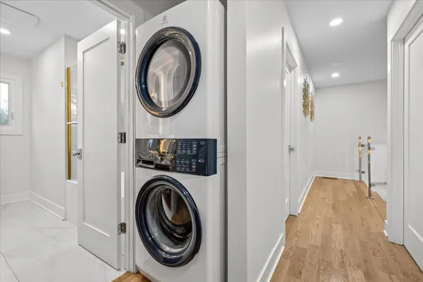 a view of a hallway with washer and dryer