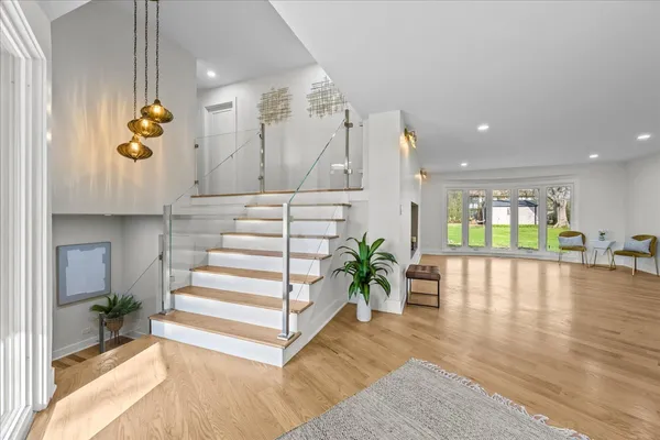 a view of an entryway with wooden floor